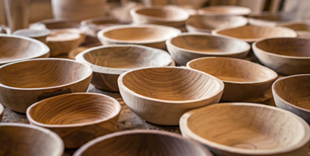Variety of turned wooden bowls in different hardwood and softwood species
