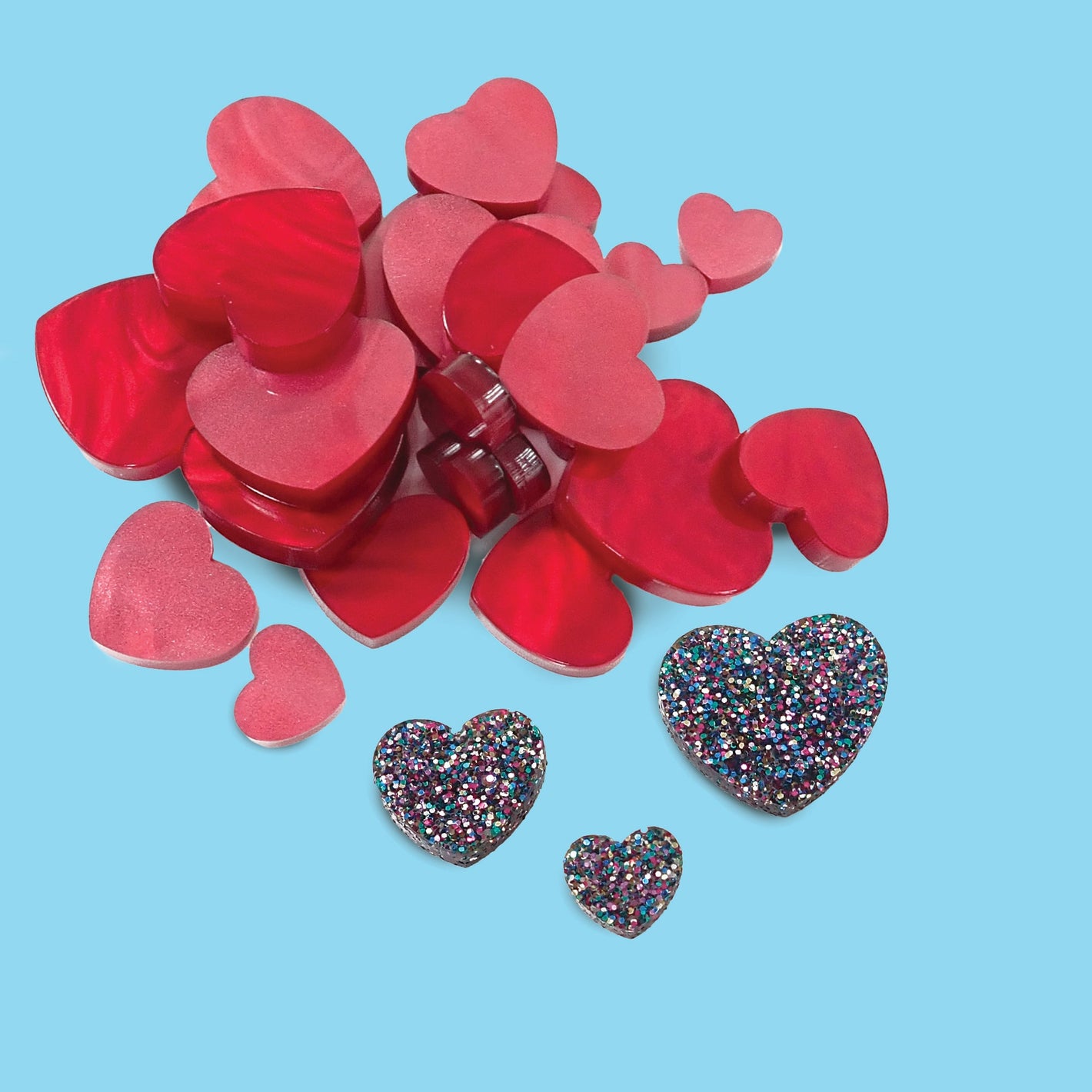 Assortment of pre-cut craft shapes in different materials and patterns